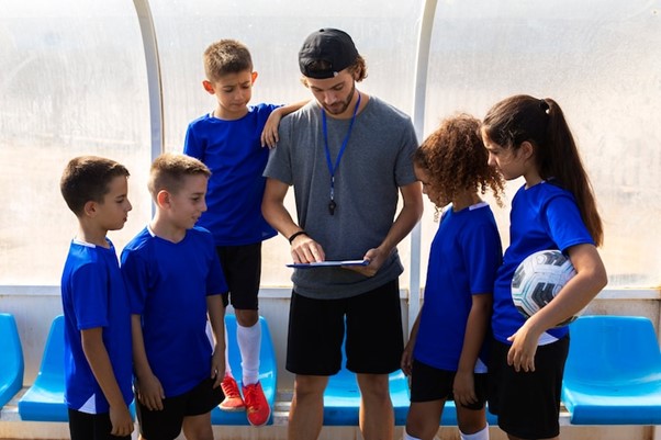 Front view trainer talking to players